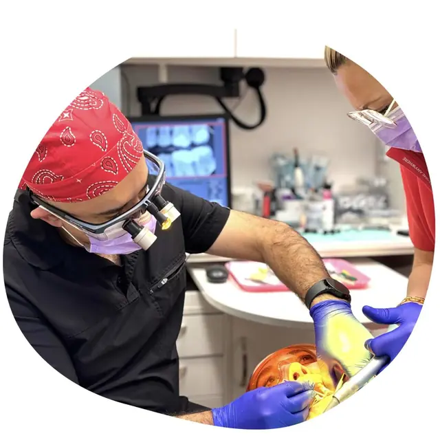 Restorative dentistry: a dental professional wearing loupes treats a patient