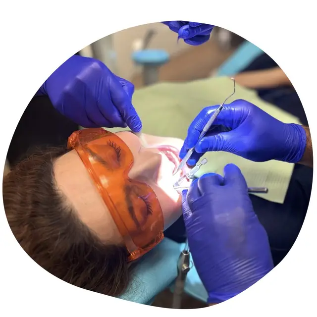 Tooth isolated with a dental dam for root canal treatment