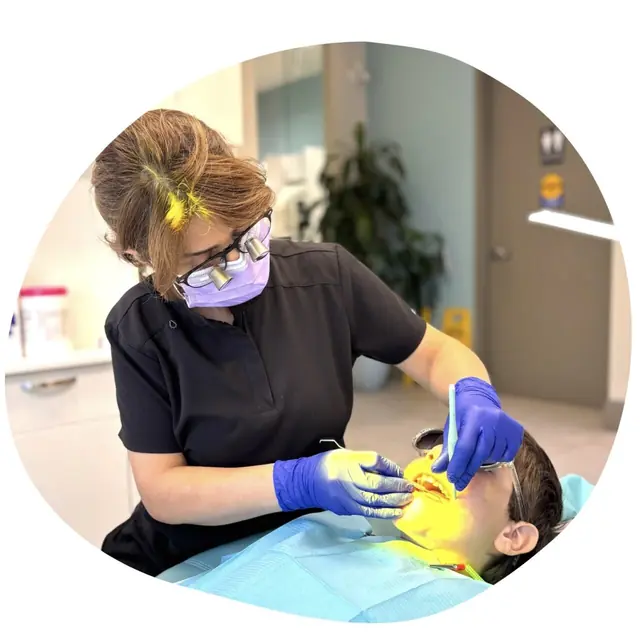 Pediatric dentistry: a dental professional examines a child’s mouth